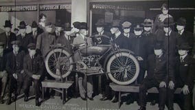 Photo with masked subjects from 1919 welcomes guests to Harley-Davidson Museum