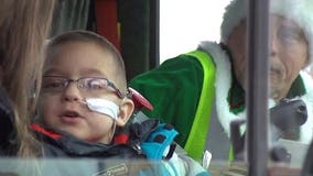 Young boy battling cancer takes break from treatment to drive trash truck