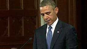 Obama's message in Boston: Defiance mixed with reassurance