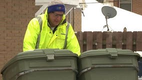 Mayor Tom Barrett gets hands dirty taking out the trash on Thursday