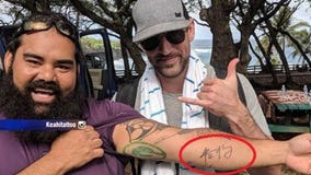 Man gets tattoo after meeting Packers' QB Aaron Rodgers in Hawaii, getting his autograph