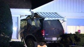 Racine police search for driver who crashed SUV into home