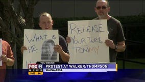 Dems protest at Walker, Thompson news conference