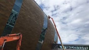 Escalators and stairs, precast and zinc panels being installed on new Bucks arena