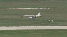 2-seat private plane runs into grass at end of runway at Mitchell International Airport