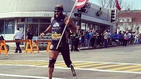 Retired Marine who lost leg in Afghanistan runs Boston Marathon carrying the American flag