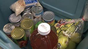 Volunteers fill Thanksgiving bins for needy families