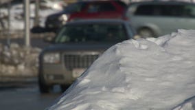 Back-to-back snowstorms leave huge piles of snow at street corners; shoveling it all can be dangerous