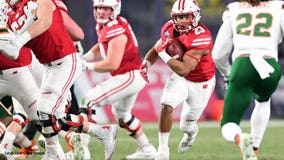 Taylor runs for 205 yards in Wisconsin's Pinstripe victory