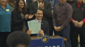 Gov. Walker signs 9 bills limiting welfare: 'More like a trampoline; less like a hammock'