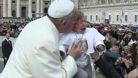 Pope Francis kisses "mini Pope" in St. Peter's Square