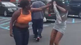 Mother viciously beats woman over parking space as husband cheers her on, children watch