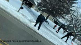 Greenfield officer calls for backup; police help elderly woman shovel driveway ❄️ 🚓