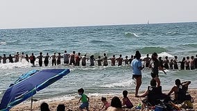 Beachgoers formed human chains amid rough waters on Lake Michigan; 2 drowned