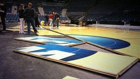 NCAA basketball floor assembled by Waukesha company