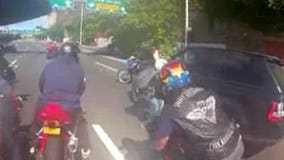 Biker who swung helmet in SUV attack 'overreacted' but didn't beat driver, lawyer says