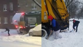 Shovels in hand, MPS students help free a couple of garbage trucks from the snow