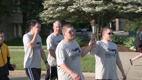 "For a wonderful cause:" Law enforcement officials carry "flame of hope" in Special Olympics torch run