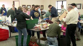 "A box of love:" Hunzinger Construction prepare care packages to send to troops