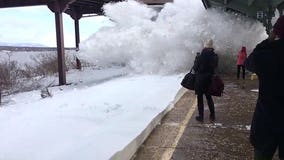 Mesmerizing video captures moment train blasts waiting passengers with snow