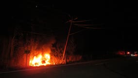 Vehicle strikes utility pole, catches fire in Ozaukee County, driver flees the scene