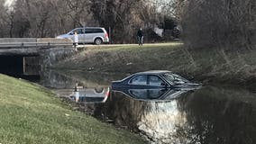 Greenfield police on the scene after car ends up in creek; driver not injured