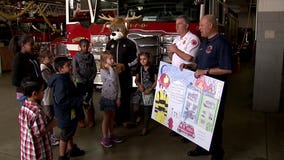Winners of MFD "Poster to Billboard" contest receive special lunch at fire station
