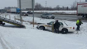 Racine officer hurt after squad is struck, ends up in ditch