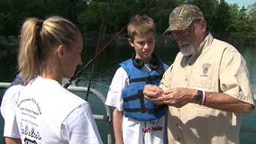 Getting "hooked:" Officers team up with special needs kids for a day of fishing