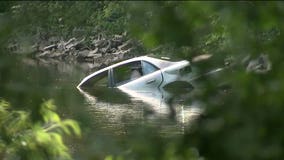 Video: 2 in custody after bank robbery pursuit, officials pull vehicle from river