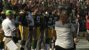 Locked arm in arm: Green Bay Packers stand for national anthem, fans weigh in on NFL protests