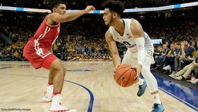 Marquette beats No. 12 Wisconsin 74-69 in OT; Howard has 27