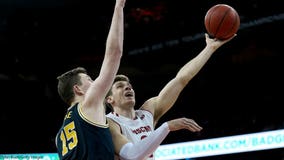 Happ, Wisconsin hand No. 2 Michigan its 1st loss, 64-54