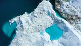 NASA scientists fly over Greenland to track melting ice