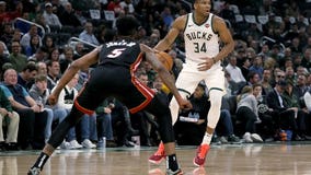 Heat spoil Bucks' home opener, rally to 131-126 win in OT