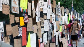 White House anti-riot fencing now covered with signs from protesters