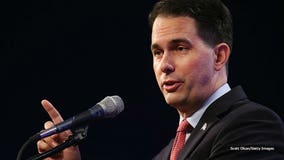 Gov. Scott Walker talks with Iowa Republicans before union vote