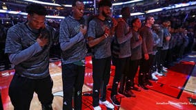 "Not a protest:" Milwaukee Bucks stand together in 'show of unity' during national anthem