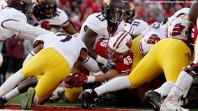 Axe stays in Madison: Badgers beat Golden Gophers 31-17 in stunning 4th quarter