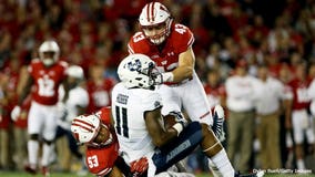 No. 9 Wisconsin overcomes slow start, routs Utah State 59-10