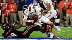 Hornibrook's 4 TDs carry Badgers over Miami, 34-24 in Orange