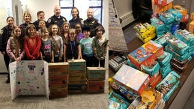 Girl Scouts drop by with dozens of boxes of cookies for Glendale Police Department