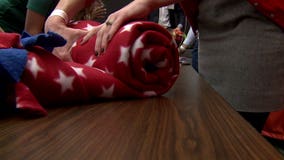 Wrap, wrap, rap: Young professionals gather to make blankets for homeless teens; "something we must do"