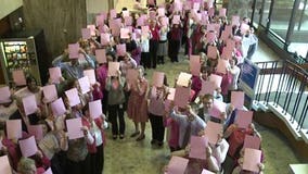 Milwaukee law firm creates human pink ribbon for breast cancer awareness