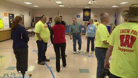 "Don't sit this one out:" Dozens gather at IBEW headquarters to push Democratic vote