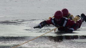 'Today was perfect:' Firefighters take advantage of warmer temps during ice rescue training