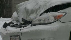 Intersection in downtown Milwaukee closes as cars slip and slide