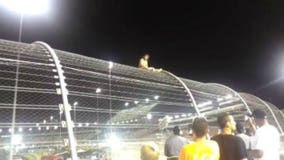 Half-naked NASCAR fan climbs fence at Richmond International Raceway