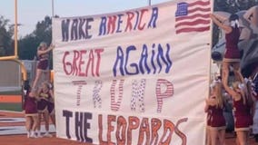 School draws criticism and support after cheerleaders hold Pres. Trump banner at football game