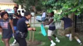 Officer on leave after video shows him restraining girl, pulling gun on teens at pool party